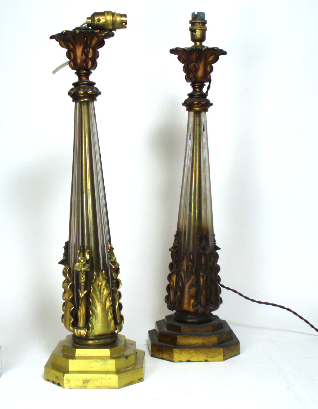 A pair of late 19th century gilt metal and glass lamps