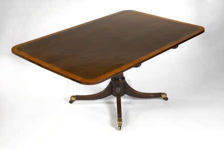 A Regency period mahogany and satinwood crossbanded breakfast table