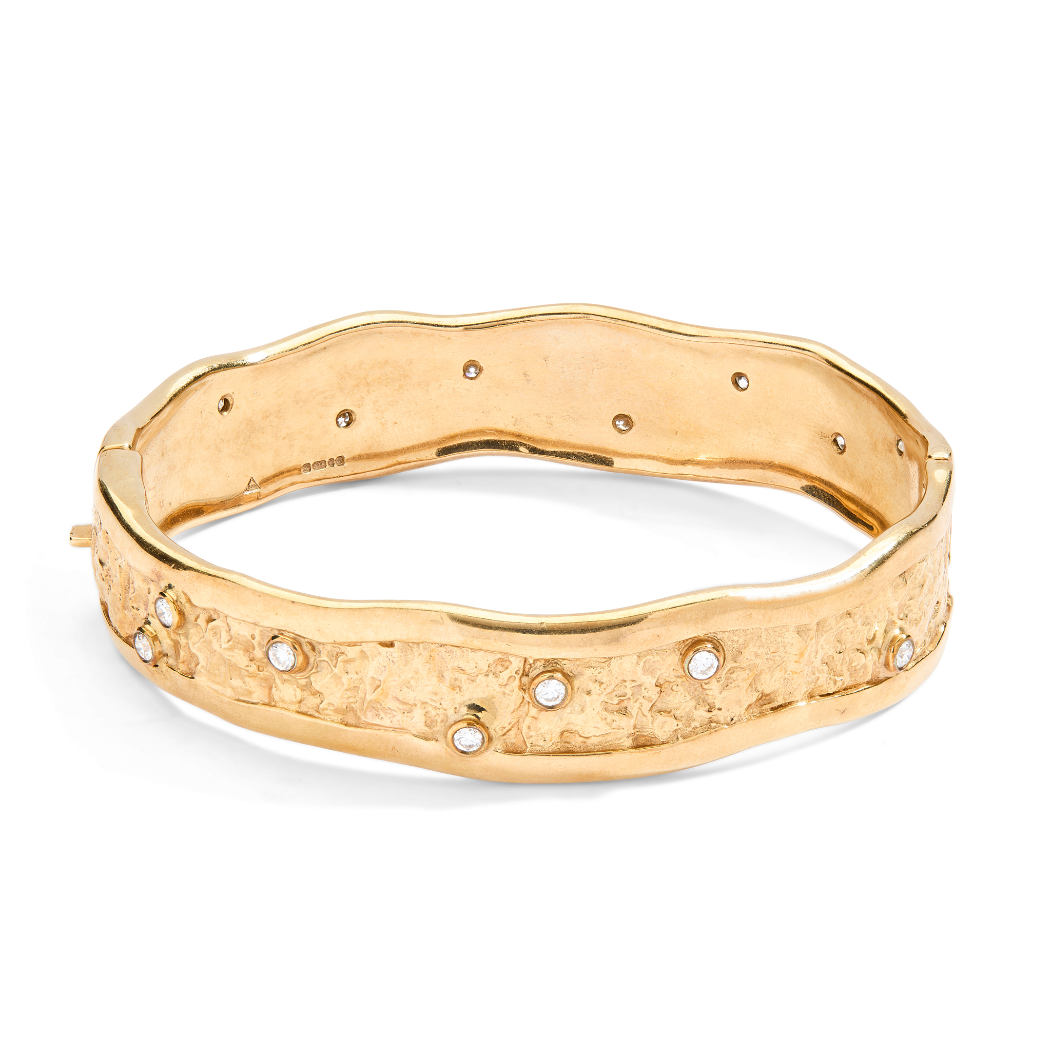Catherine Jones: A 9ct gold diamond bangle