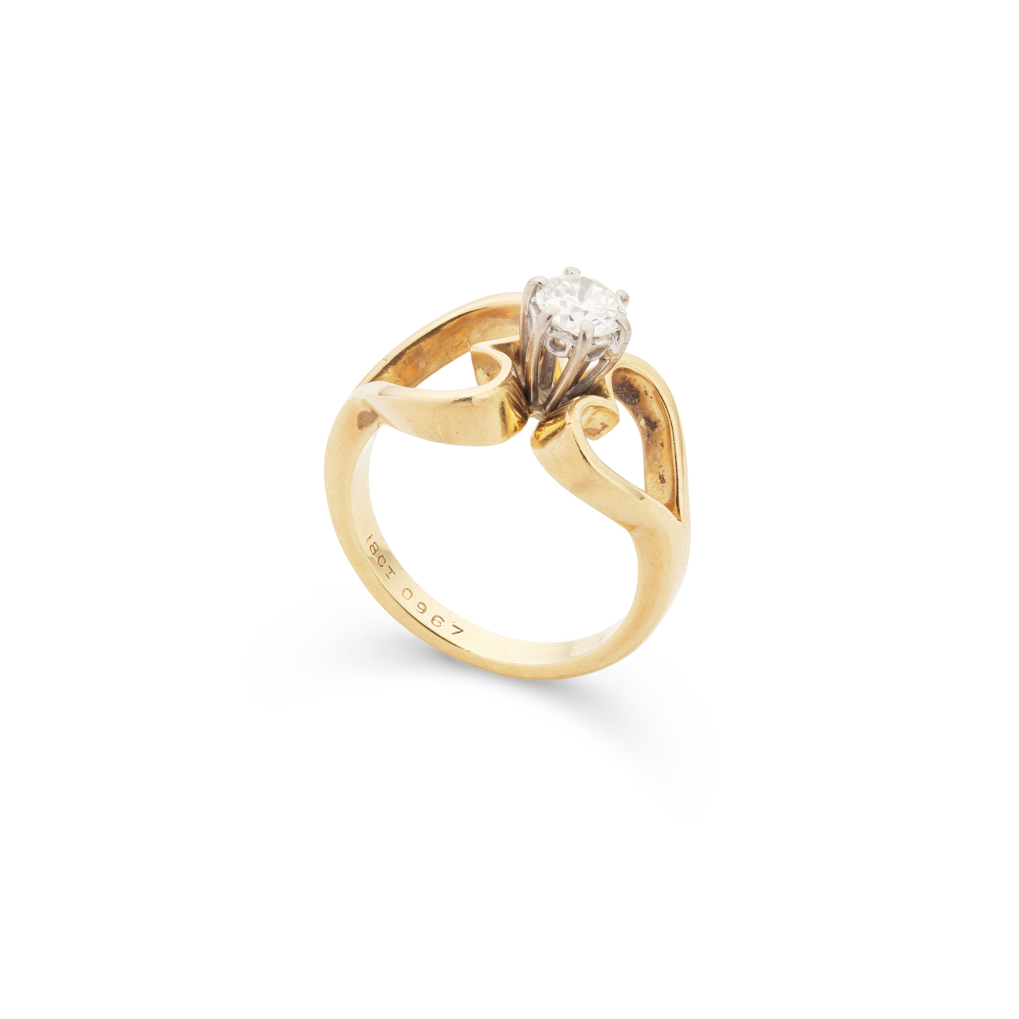 A diamond single-stone dress ring
