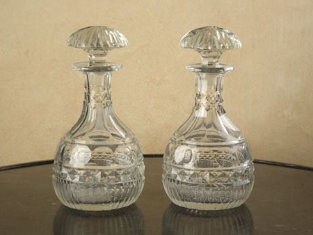A pair of large cut glass decanters and stoppers
