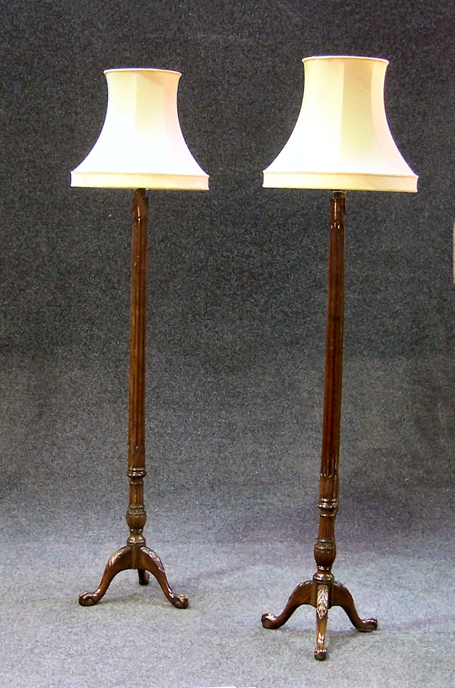 A pair of mahogany standard lamps,