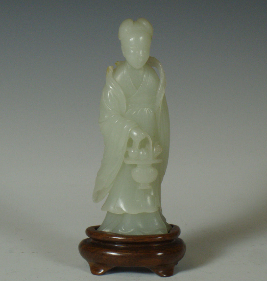 A Chinese celadon jade figure of a lady