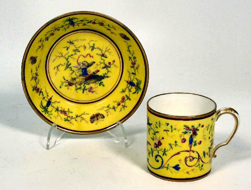 A late 18th century Sevres yellow ground cup and saucer