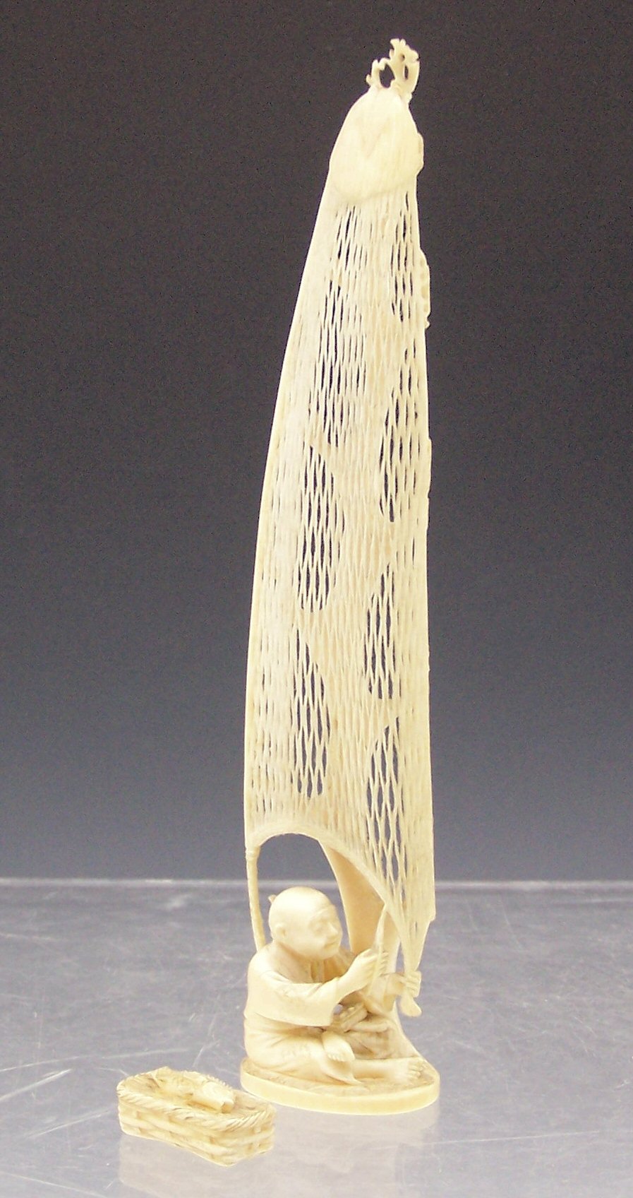 A Japanese ivory figure, Meiji period,