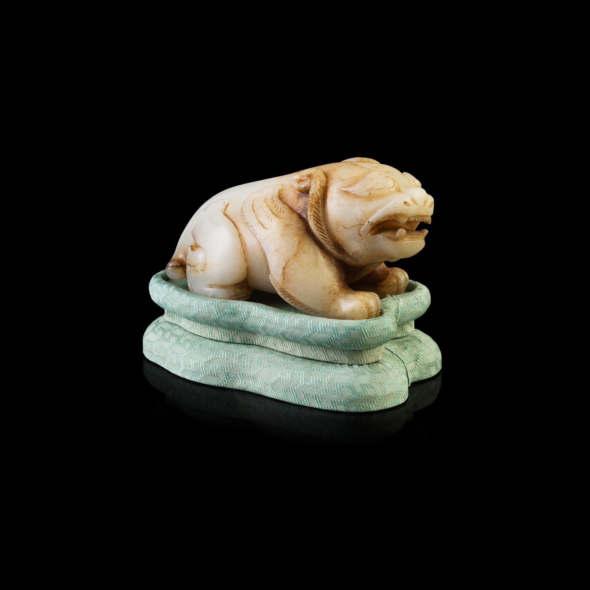 WHITE JADE CARVING OF A MYTHICAL ANIMAL