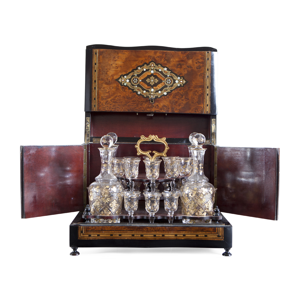 A FRENCH AMBOYNA AND BRASS MOUNTED DECANTER STAND