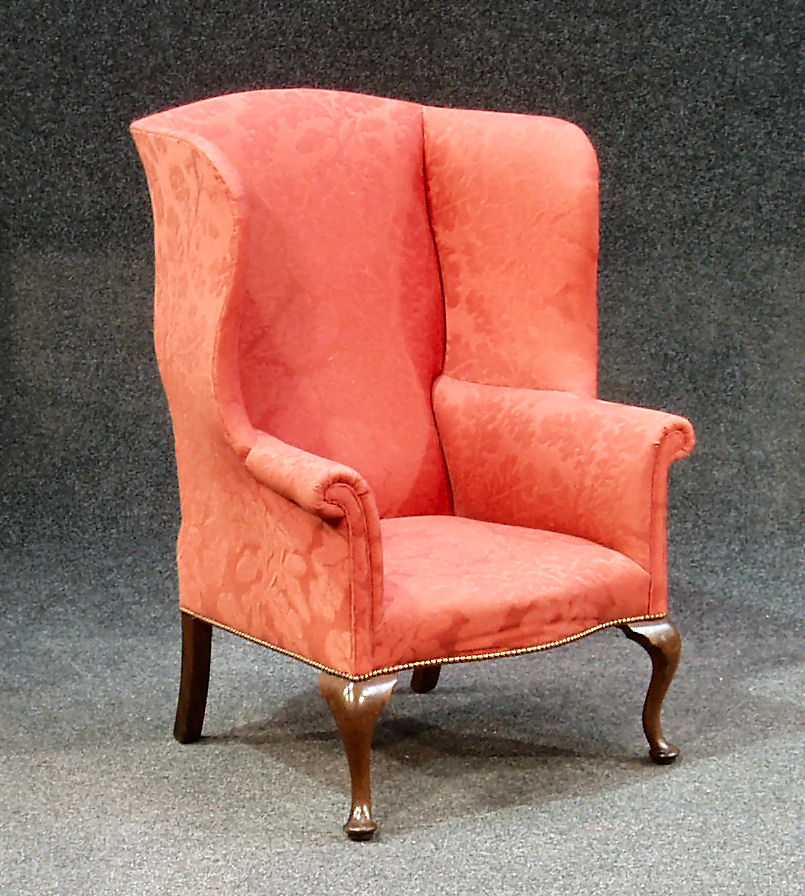 A Georgian mahogany framed wing back armchair