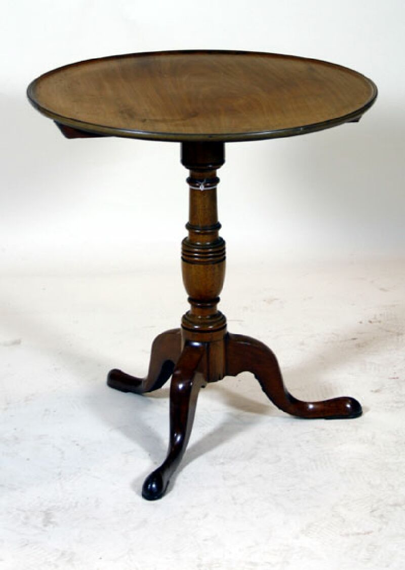 A 19th century mahogany circular tilt top table