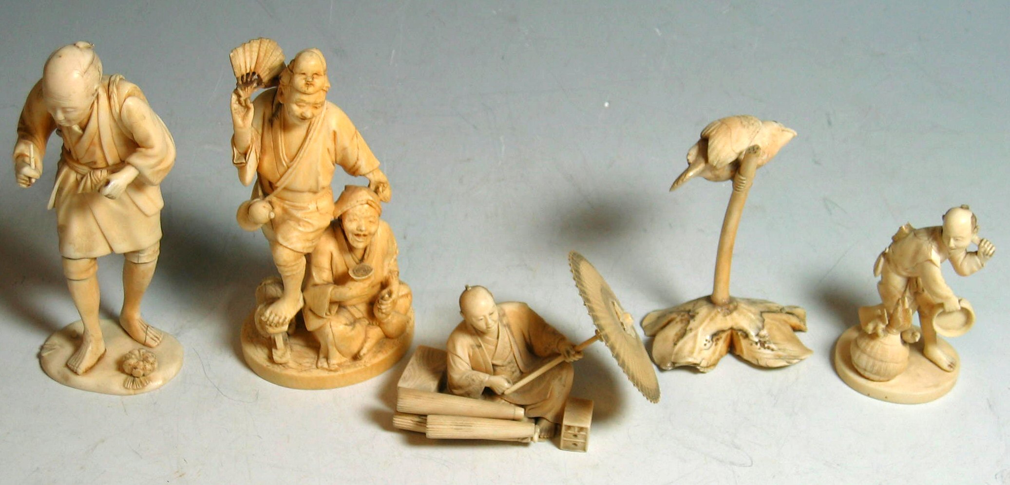 A collection of five ivory figures,