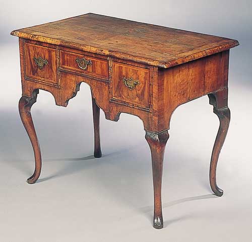 An early 18th century walnut lowboy