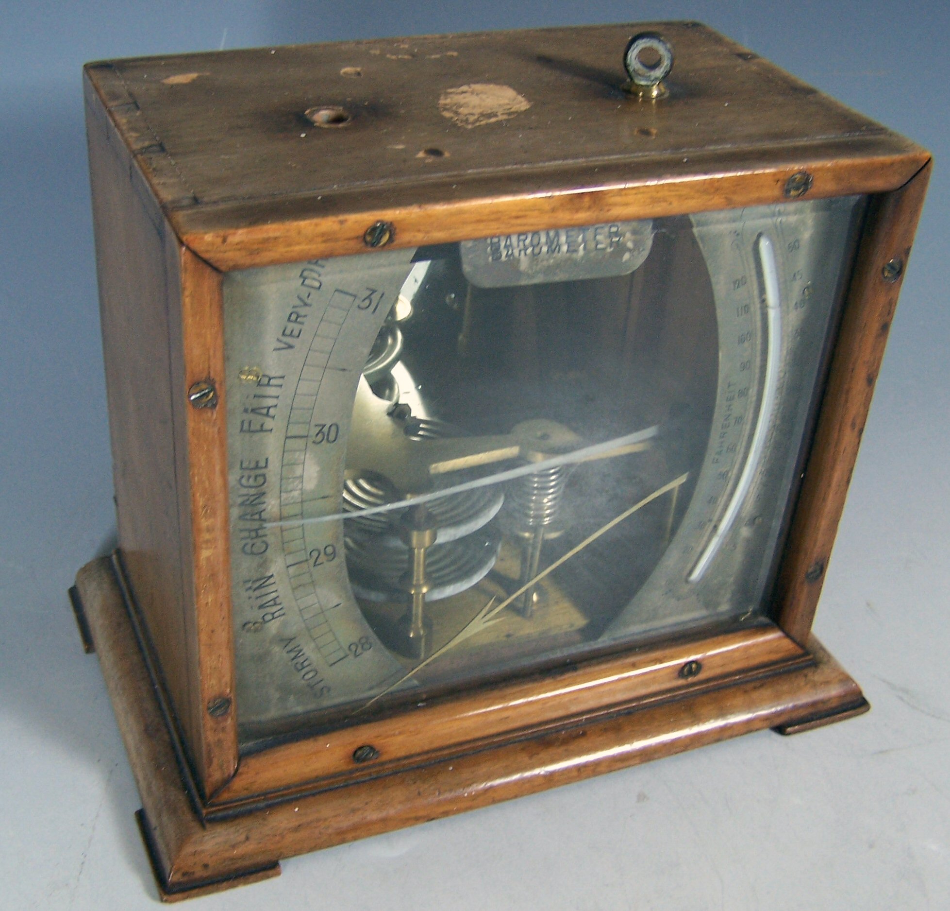 A wooden cased Atmos barometer,