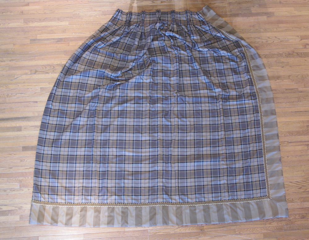 A pair of handmade brown tartan curtains