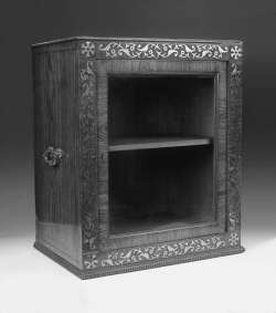 An early 19th century rosewood and brass inlaid table cabinet