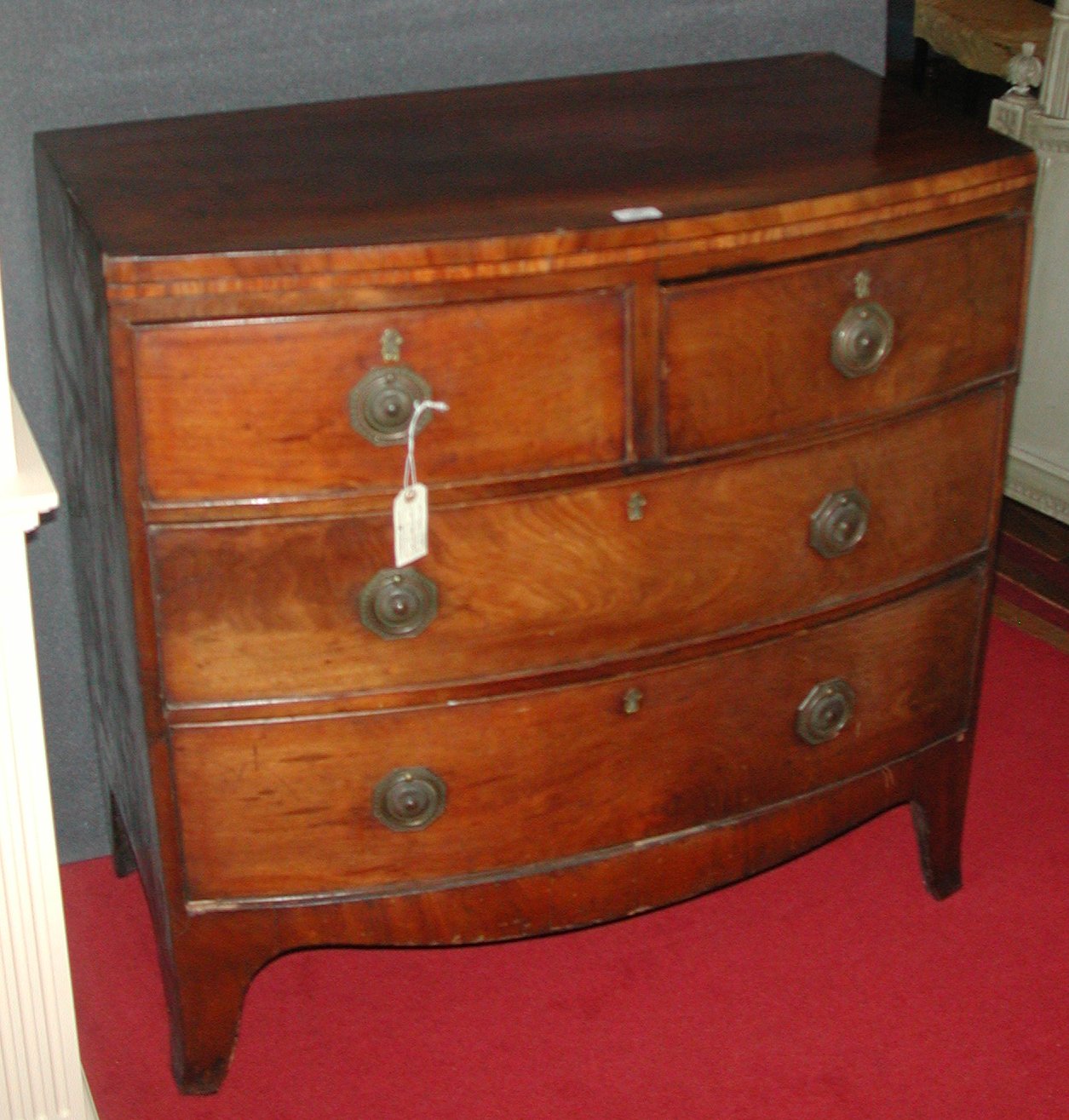 A George III mahogany bow front chest,