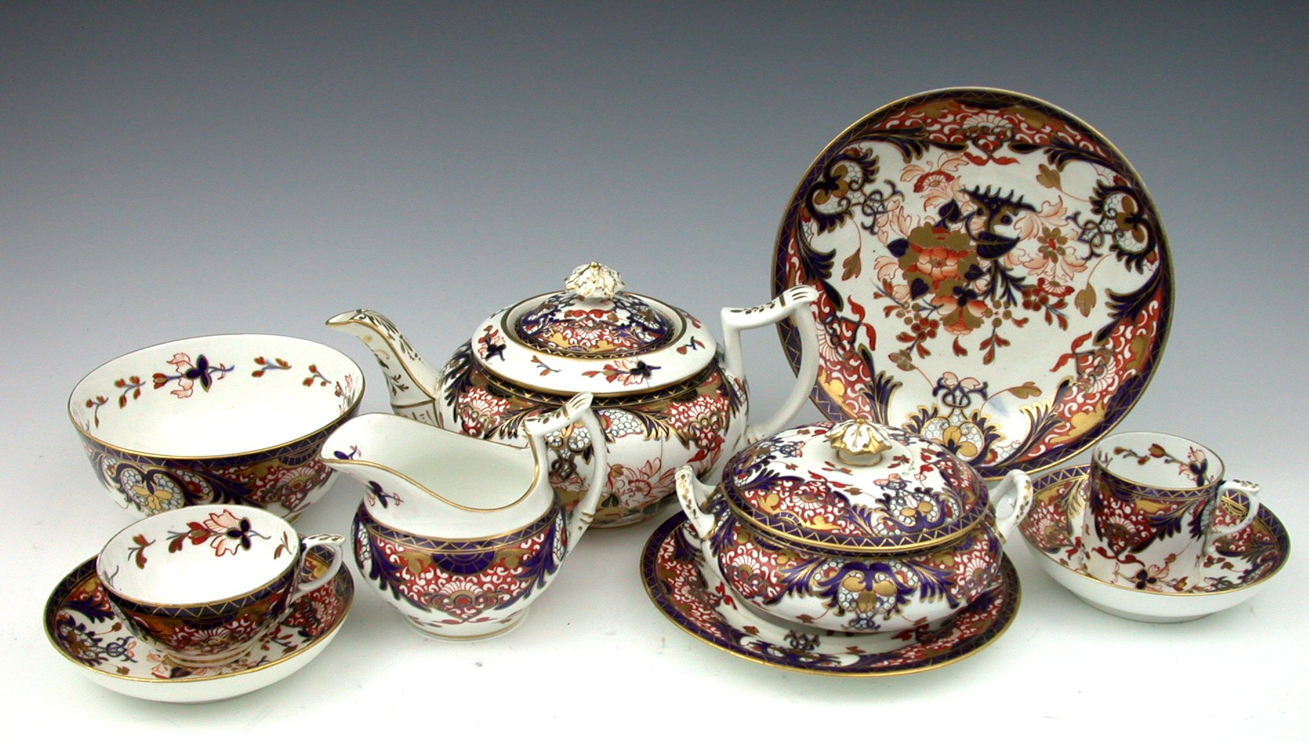 A 19th century Derby Imari palette composite tea and coffee set,