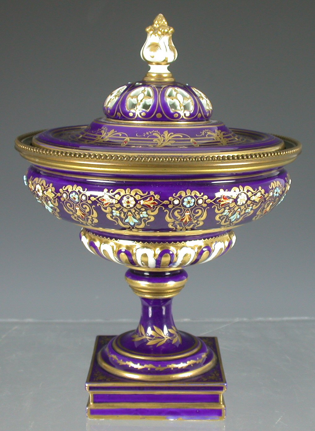 A late 19th century Sevres style brass mounted pot pourri urn and cover,