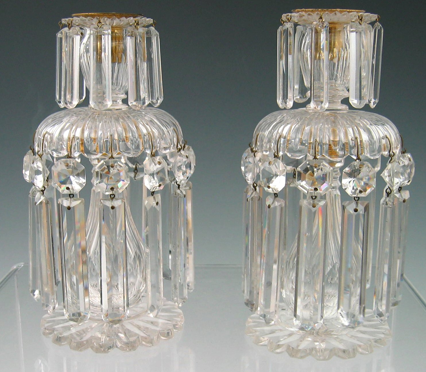 A pair of cut glass candle lustres, 19th century,
