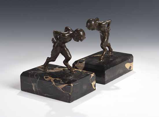 A pair of bronze book ends