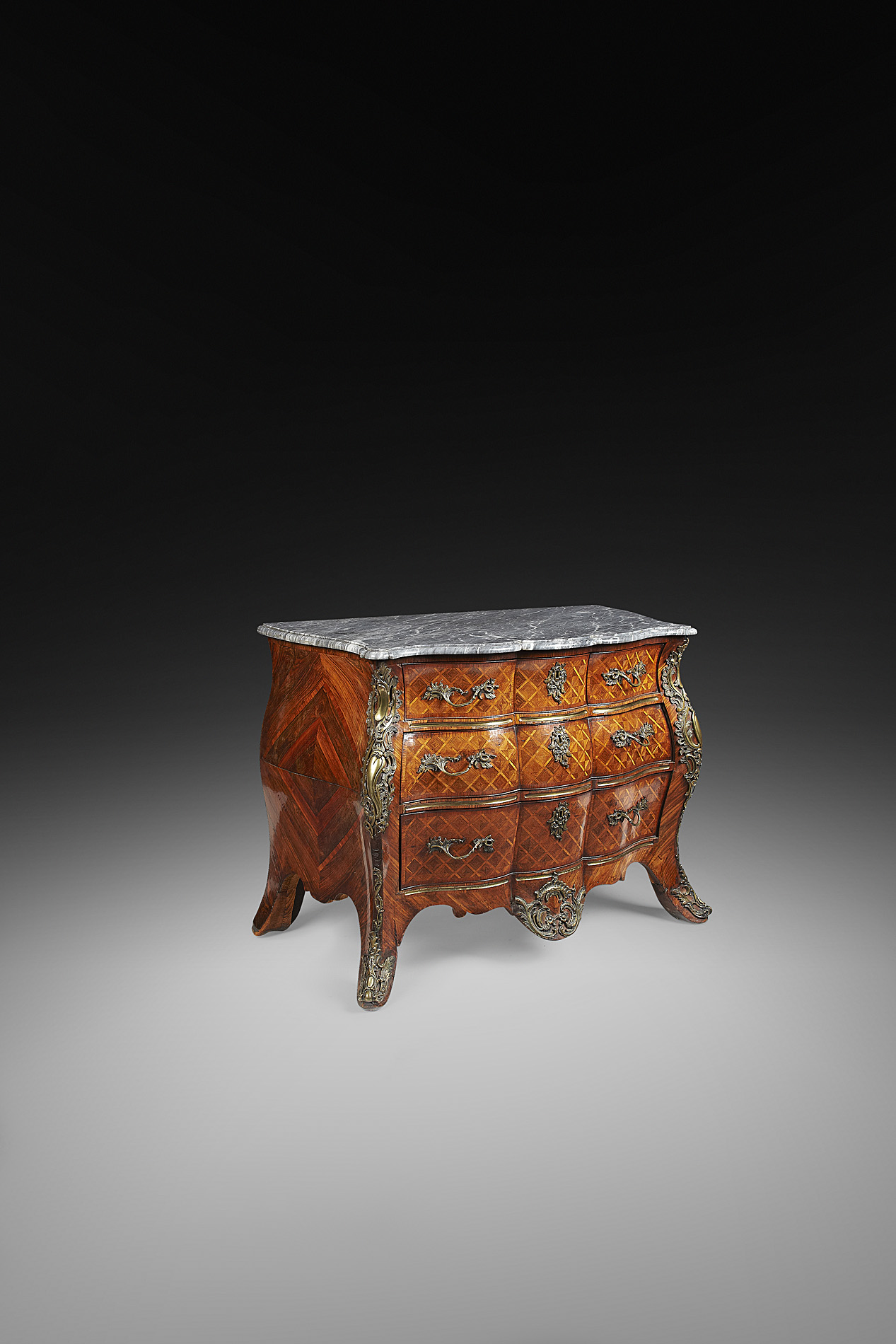 FINE GERMAN PARQUETRY AND GILT BRONZE MOUNTED BOMBE COMMODE
