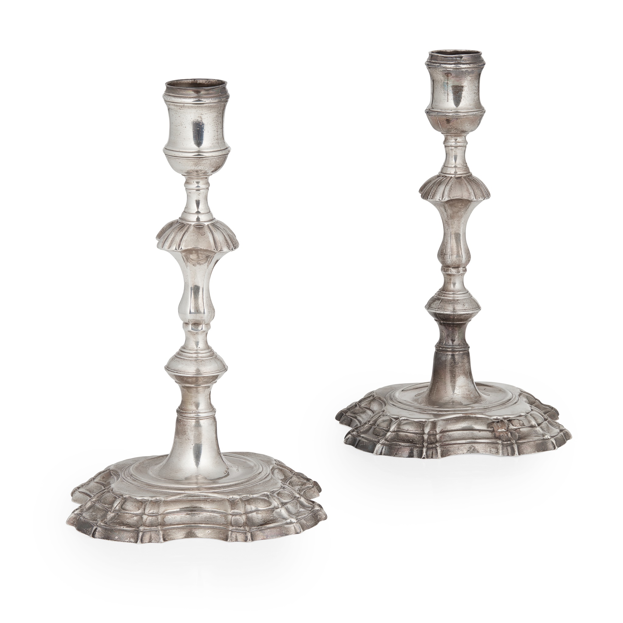 A pair of George II candlesticks