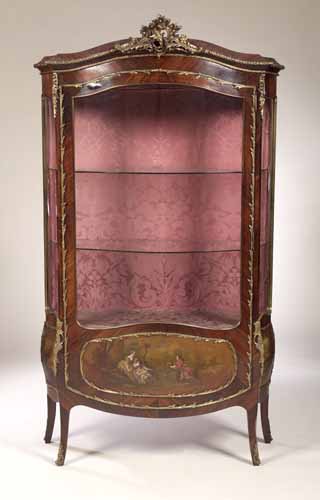 An early 20th century Louis XV style rosewood bombe vitrine,