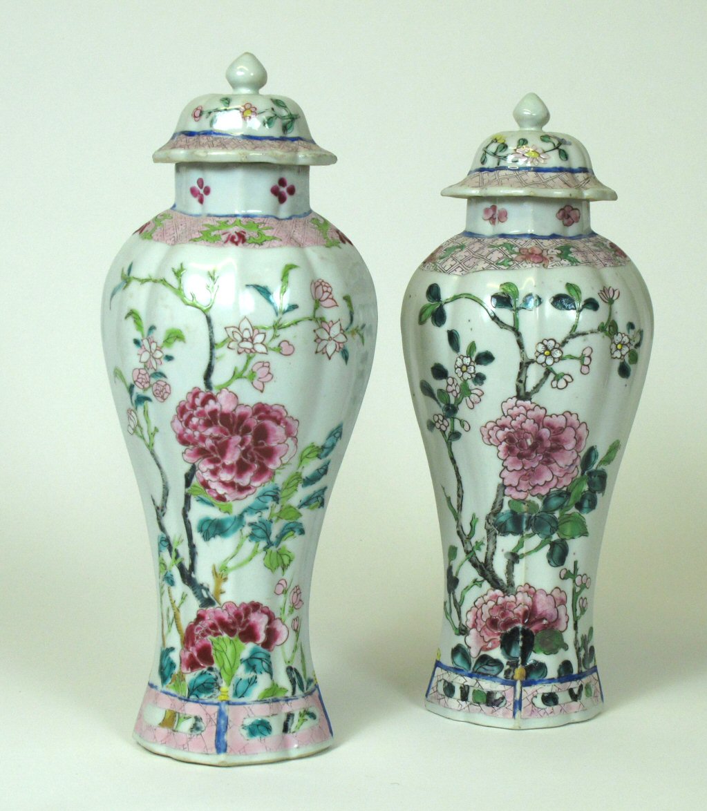 NEAR PAIR OF CHINESE FAMILLE ROSE DECORATED VASES AND COVERS