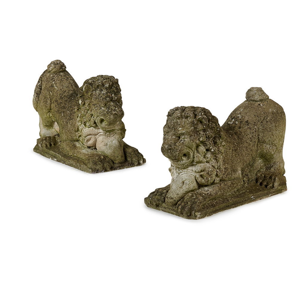 A PAIR OF COMPOSITION STONE LION FIGURES
