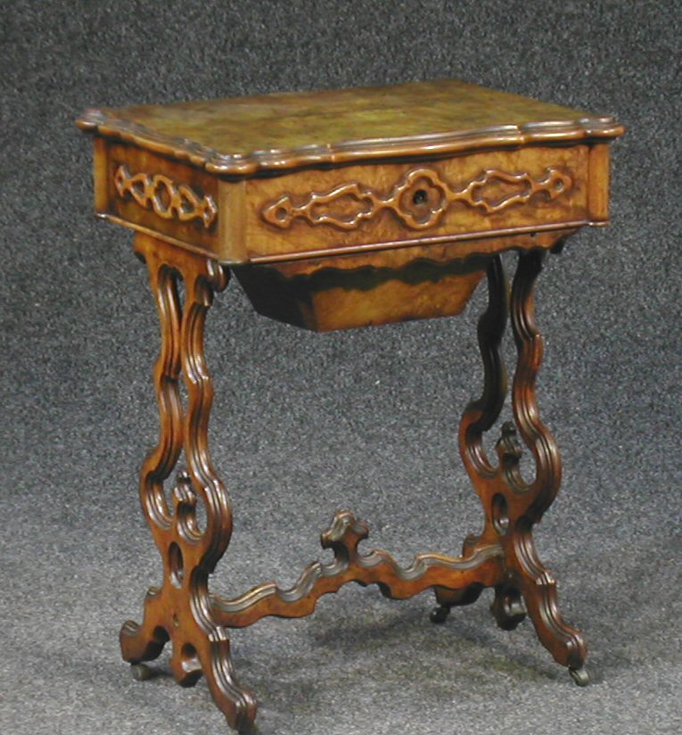 A Victorian walnut work table,