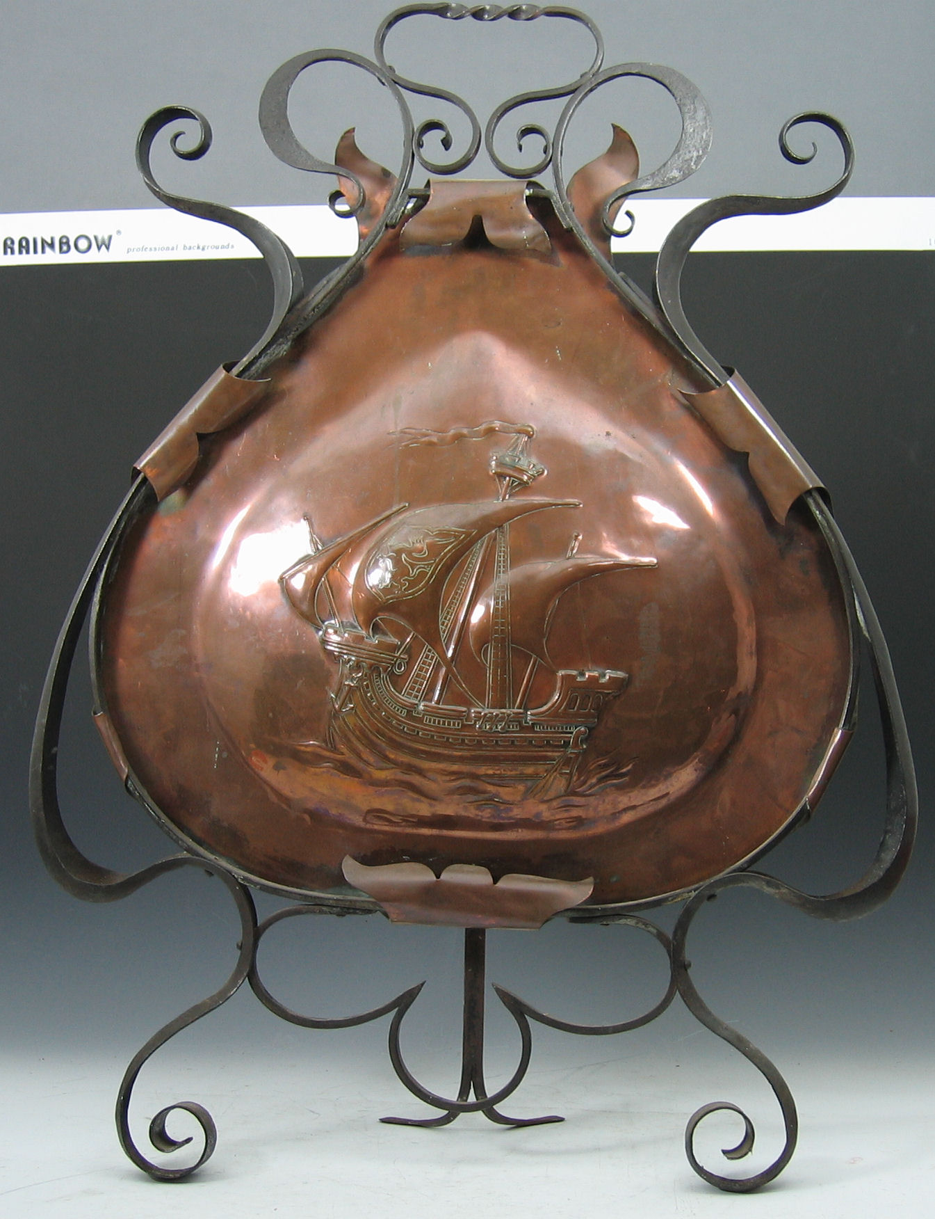 A Newlyn style copper and wrought iron firescreen,