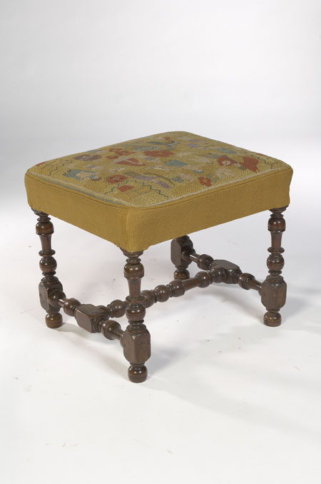 An early 18th century walnut framed dressing stool