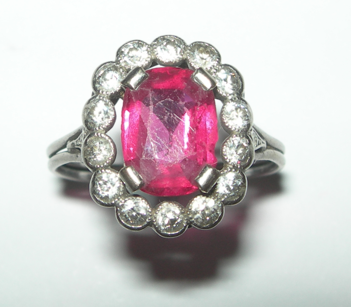 A Belle Epoque ruby and diamond set cluster ring,