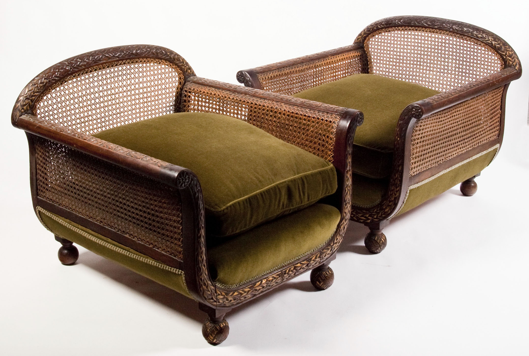 An early 20th century mahogany framed bergere suite