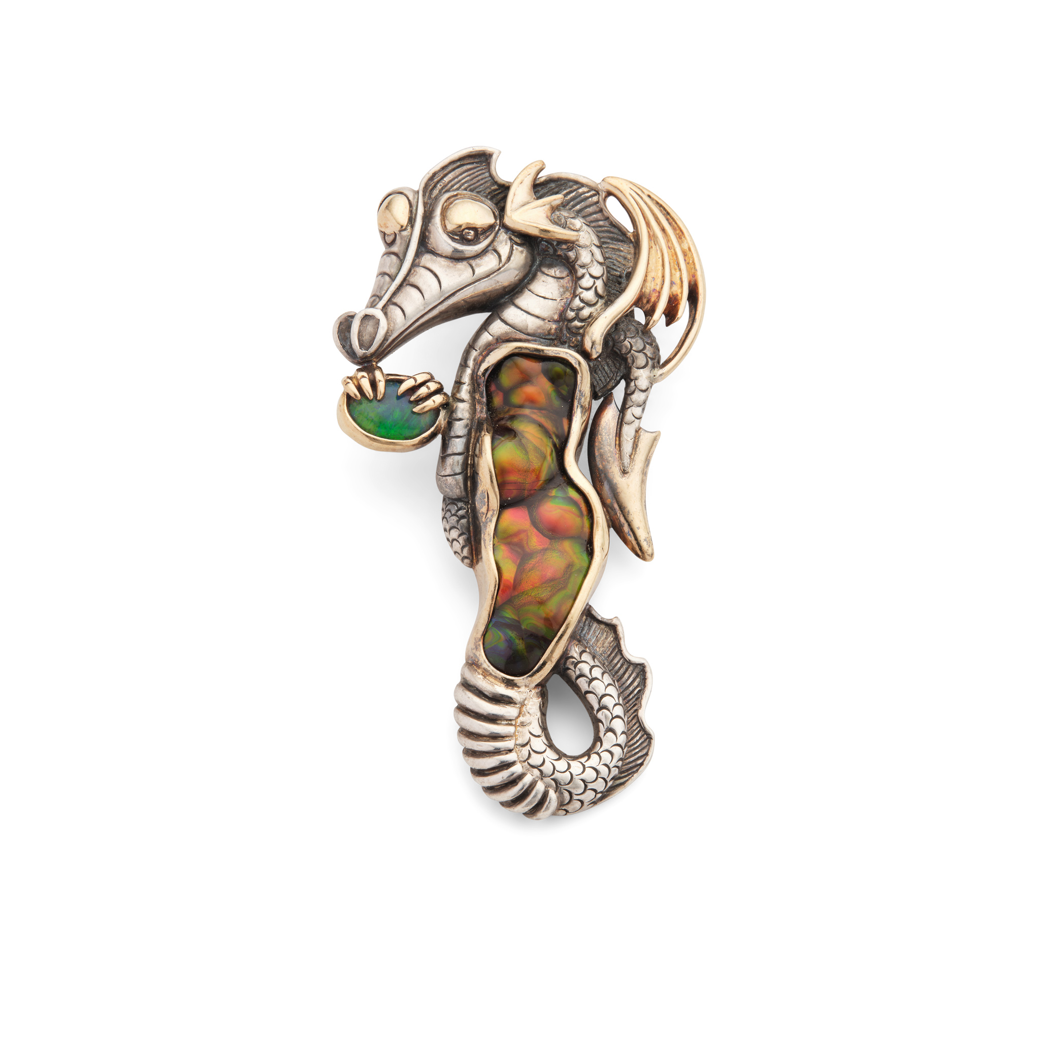 A silver gem-set dragon pendant