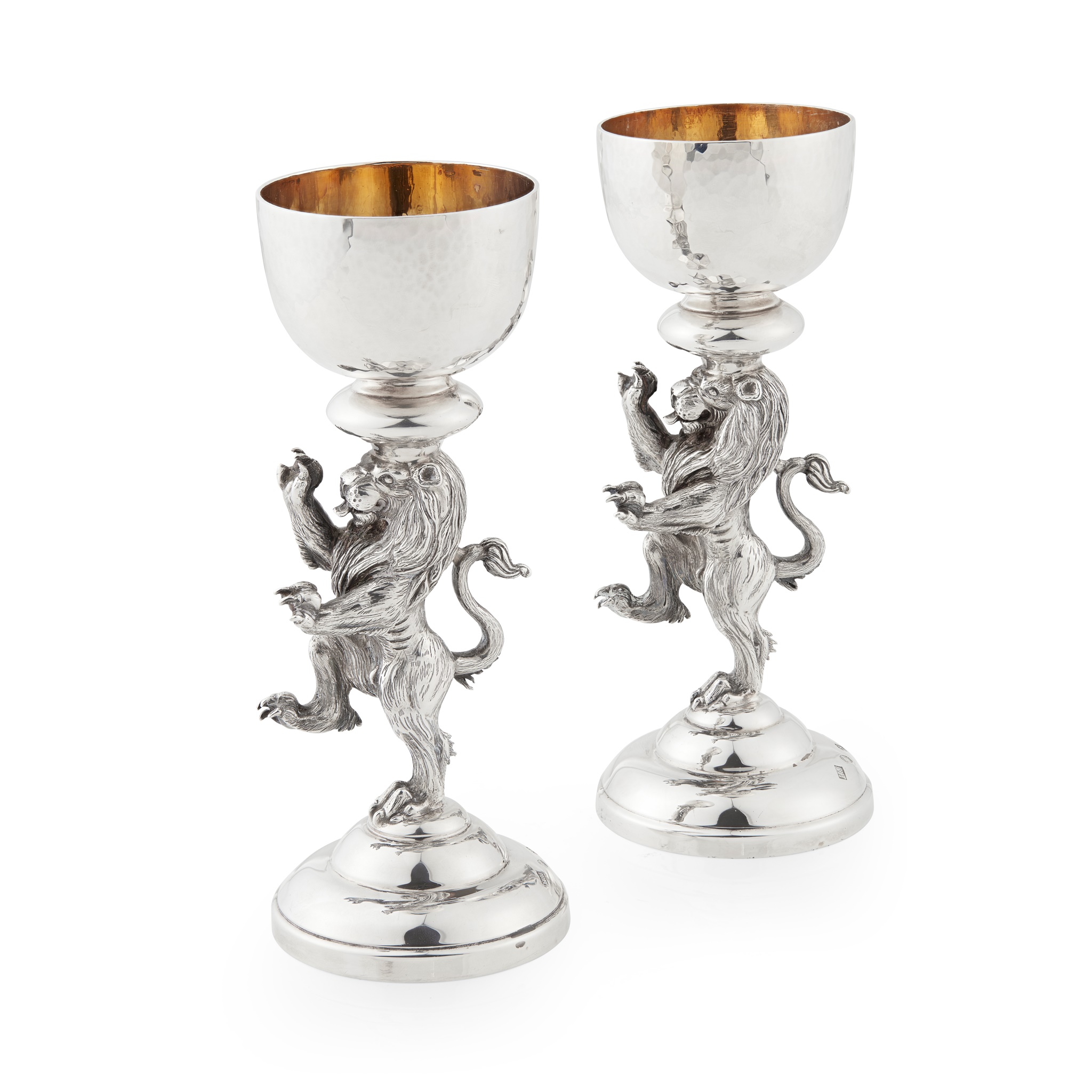 A pair of cast modern figural candlesticks