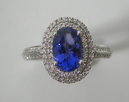 A platinum mounted tanzanite and diamond cluster ring,