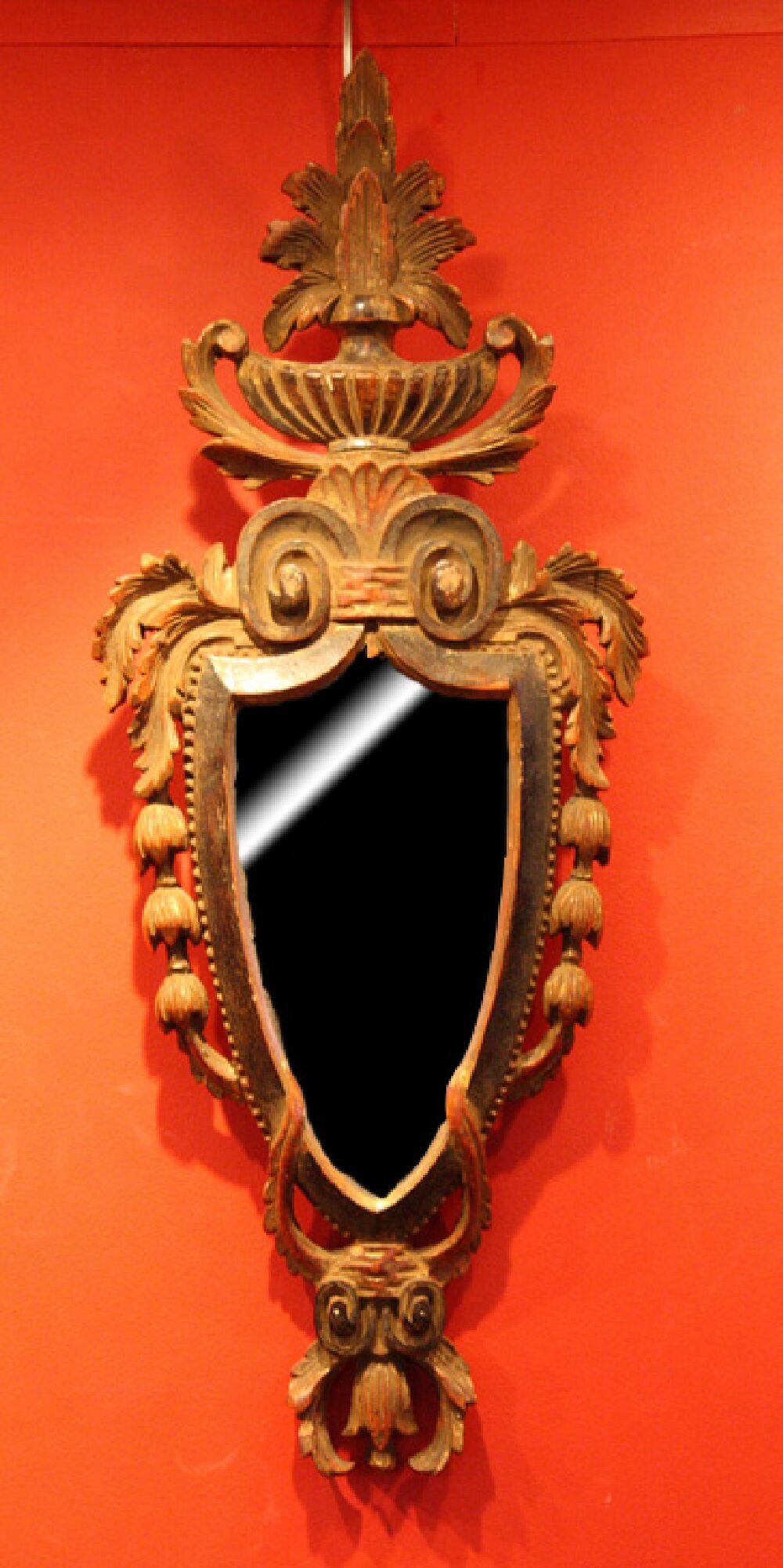 A pair of Venetian style carved giltwood wall mirrors