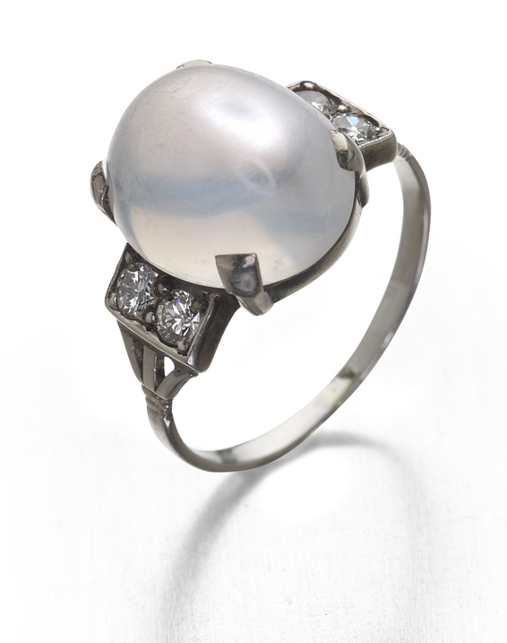 An Art Deco moonstone and diamond set ring,