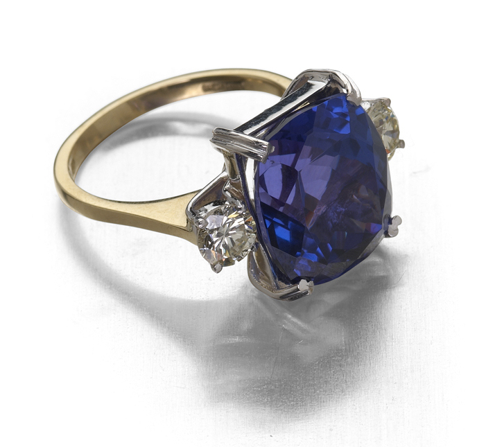 An 18ct gold mounted tanzanite and diamond set three-stone ring,