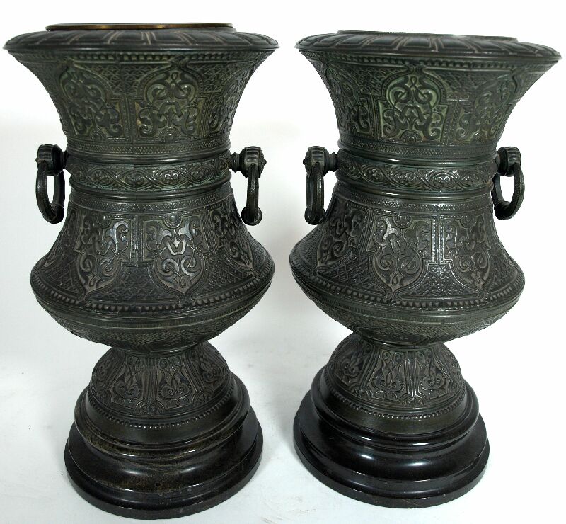 A pair of Middle Eastern bronzed metal vases