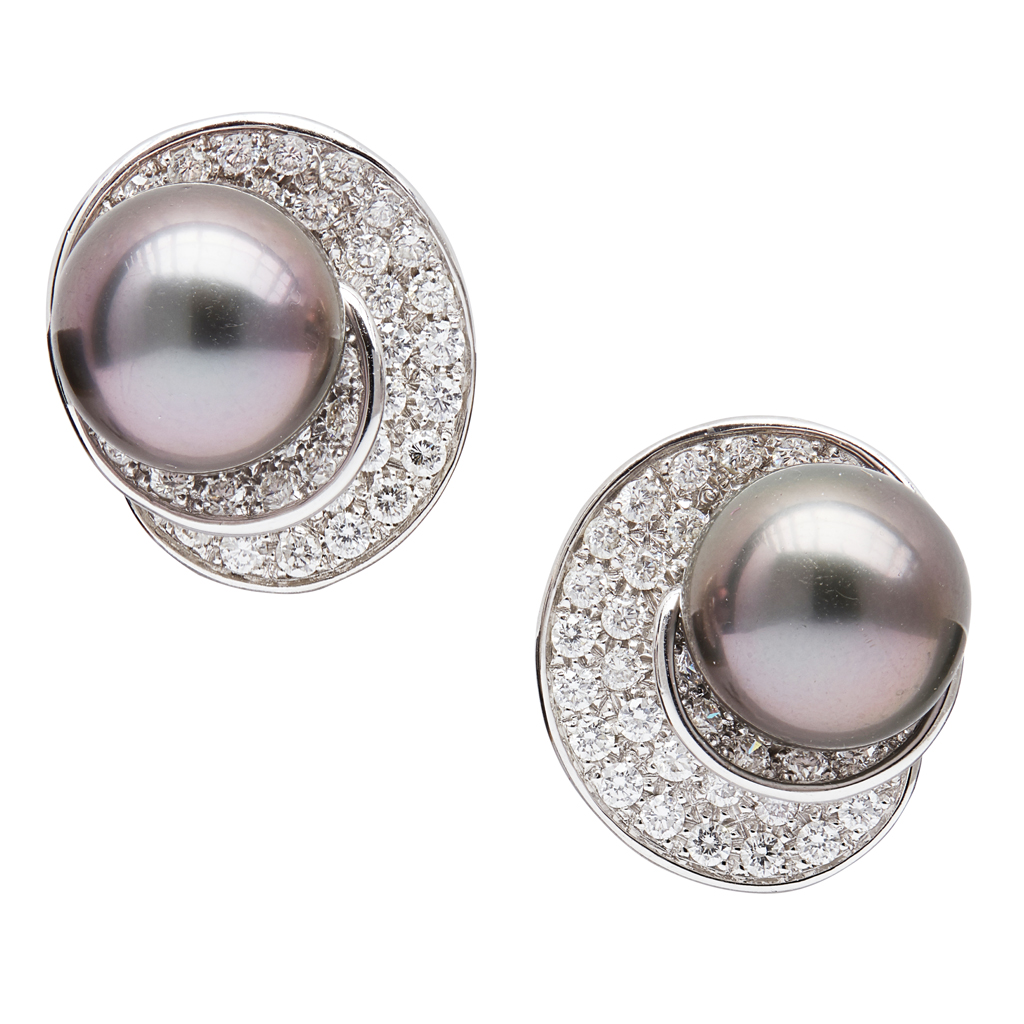 A pair of pearl and diamond set earrings