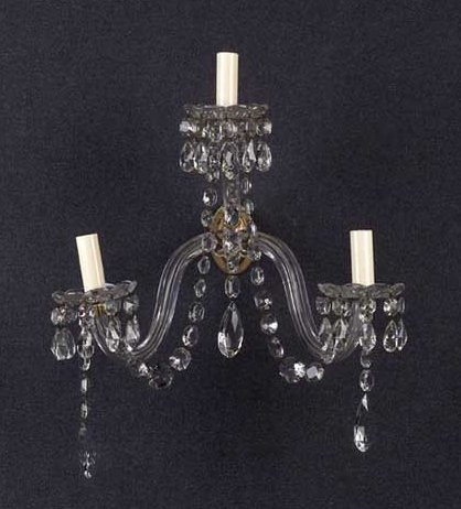 A set of four cut glass wall appliques