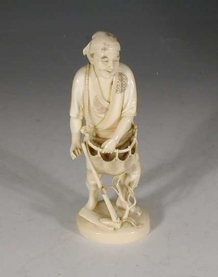 A late 19th century Japanese carved ivory figure