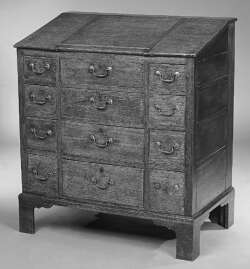 An early 19th century oak writing chest