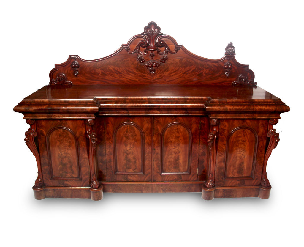A large Victorian inverted breakfront flame mahogany sideboard