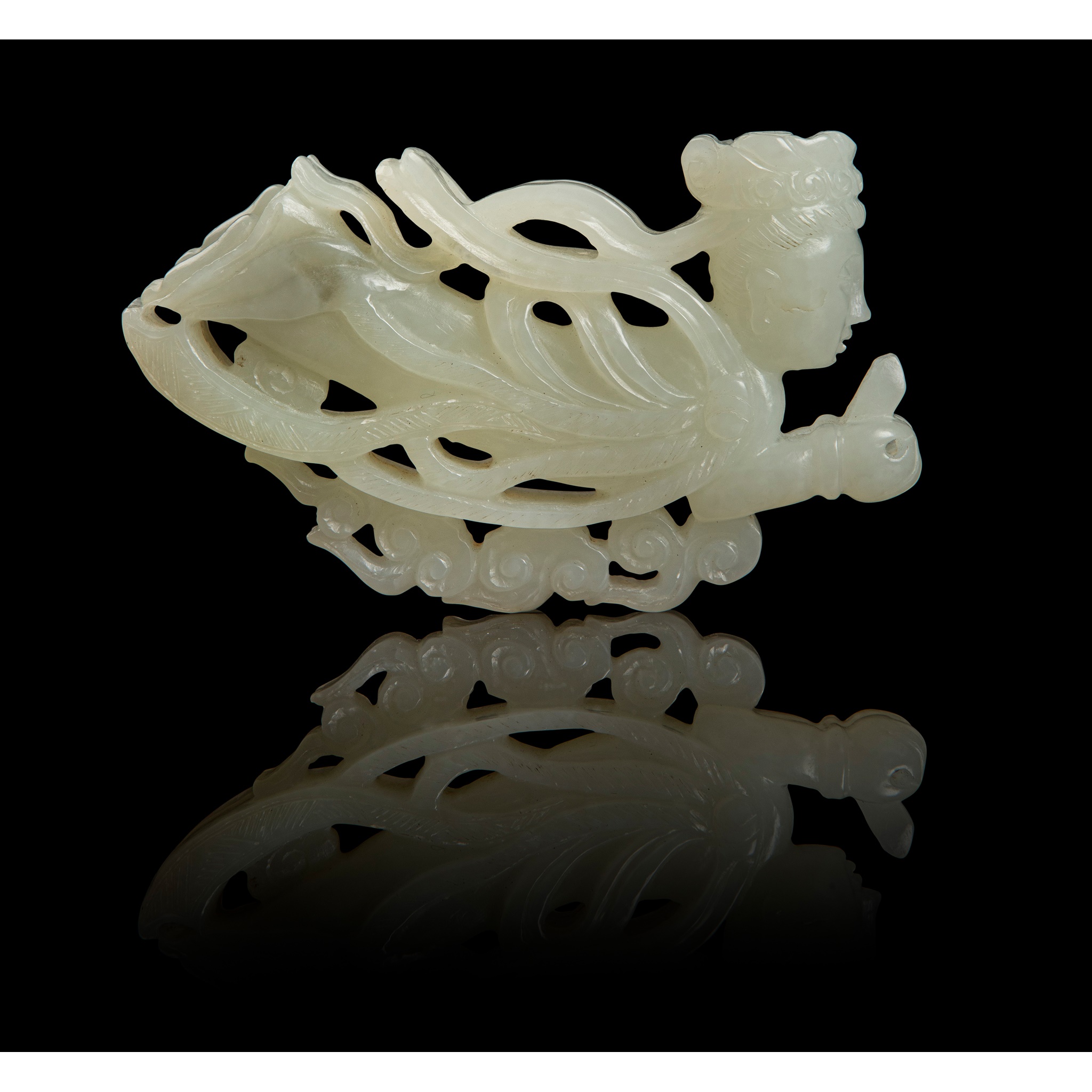 PALE CELADON CARVING OF AN APSARA