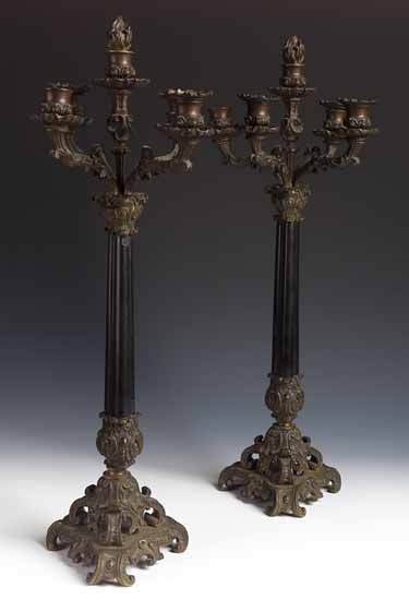 A pair of 19th century black slate and bronzed table candlebra