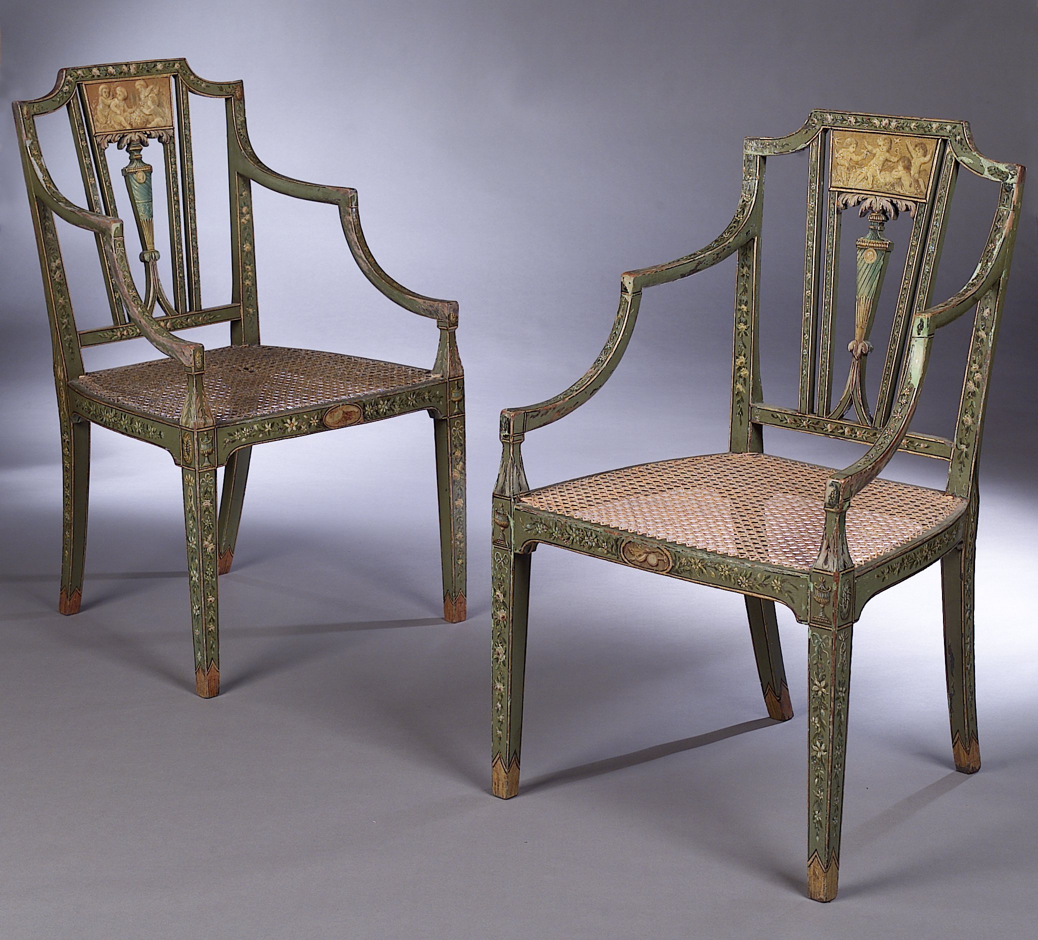 A pair of painted George III open armchairs