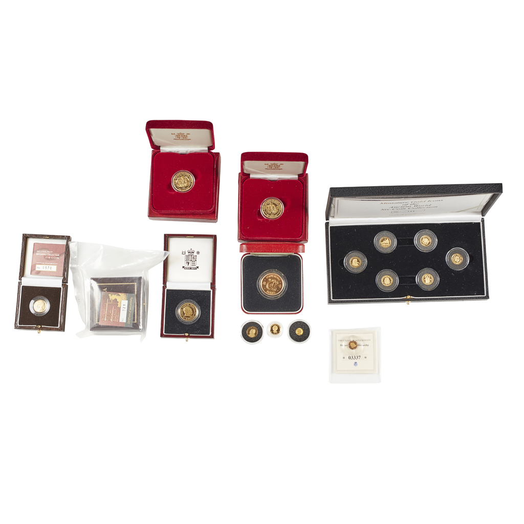 A group of various gold proof coins