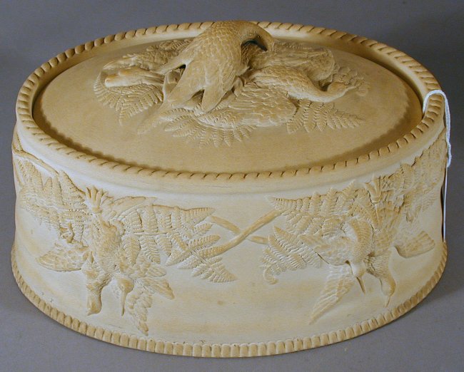 An oval Wedgwood style caneware game dish and cover